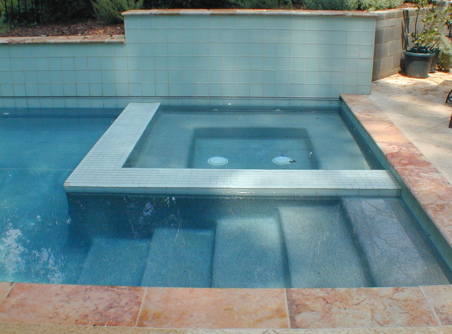 Integrated spa and steps